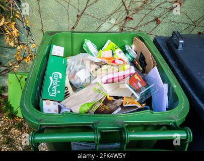 Recycling bin containing paper, cardboard, hard plastic and cans Stock Photo