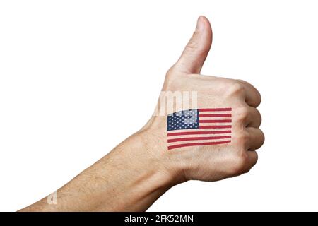 Human hand with a painted or tattooed American flag showing thumb up sign. Isolated on white. Stock Photo