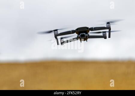 Ulyanovsk, Russia - October 13, 2018: Copter DJI Mavic Pro flies in the sky over the field on a blurred background Stock Photo