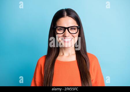 Photo of attractive person toothy beaming smile wear eyewear look camera isolated on blue color background Stock Photo