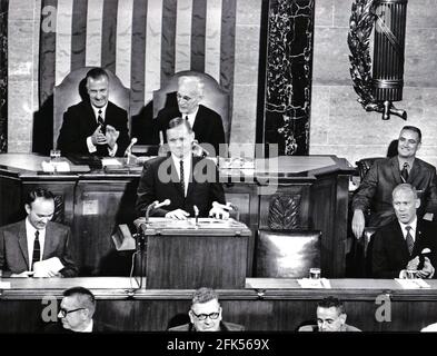 Washington, DC - (FILE) -- Astronaut Neil Armstrong displays his boyish grim as he shares the rostrum in the United States House of Representatives with fellow lunar travelers Michael Collins, left, and Edwin E. 'Buzz' Aldrin, Jr., right, as they address a Joint Session of Congress on September 16, 1969. Armstrong's remarks enjoyed the applause of Vice President Spiro Agnew, left rear, and Speaker of the House John McCormick (Democrat of Massachusetts), rear right.Credit: Arnie Sachs/CNP /MediaPunch Stock Photo