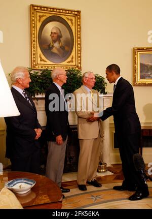 Washington, DC - July 20, 2009 -- United States President Barack Obama meets with Apollo 11 crew members (l-r) Edwin Eugene 'Buzz' Aldrin, Jr., Michael Collins, and Neil Armstrong in the Oval Office of the White House on the 40th anniversary of the astronauts' lunar landing, Washington, DC, Monday, July 20, 2009. Credit: Martin H. Simon/Pool via CNP /MediaPunch Stock Photo