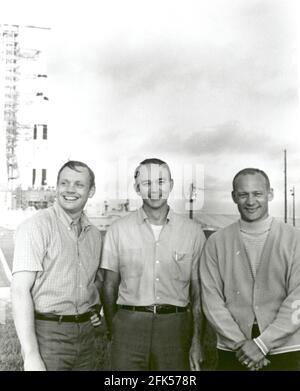 Cape Canaveral, FL - (FILE) -- On May 20, 1969, the National Aeronautics and Space Administration's (NASA) Apollo 11 flight crew, Neil A. Armstrong, commander, left; Michael Collins, command module pilot, center; and Buzz Aldrin, lunar module pilot, right, stand near the Apollo/Saturn V space vehicle that would eventually carry them into space on July 16,1969.Credit: NASA via CNP | usage worldwide Stock Photo