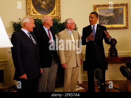 File photo - Washington, DC - July 20, 2009 -- United States President Barack Obama meets with Apollo 11 crew members (l-r) Edwin Eugene 'Buzz' Aldrin, Jr., Michael Collins, and Neil Armstrong in the Oval Office of the White House on the 40th anniversary of the astronauts' lunar landing, Washington, DC, Monday, July 20, 2009. . --- American astronaut Michael Collins, who flew the Apollo 11 command module while his crewmates became the first people to land on the Moon on July 20, 1969, died on Wednesday after battling cancer, his family said. Photo by Martin H. Simon / Pool via CNP /ABACAPRESS. Stock Photo