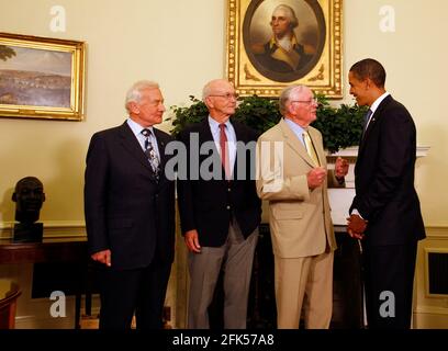 File photo - Washington, DC - July 20, 2009 -- United States President Barack Obama meets with Apollo 11 crew members (l-r) Edwin Eugene 'Buzz' Aldrin, Jr., Michael Collins, and Neil Armstrong in the Oval Office of the White House on the 40th anniversary of the astronauts' lunar landing, Washington, DC, Monday, July 20, 2009. . --- American astronaut Michael Collins, who flew the Apollo 11 command module while his crewmates became the first people to land on the Moon on July 20, 1969, died on Wednesday after battling cancer, his family said. Photo by Martin H. Simon / Pool via CNP /ABACAPRESS. Stock Photo