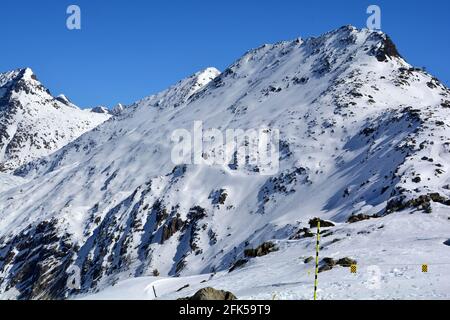 The Bettmerhorn above the Aletsch Glacier with the Betterhorn cable car on the right. In the Bernese Alps, Switzerland, in the winter Stock Photo