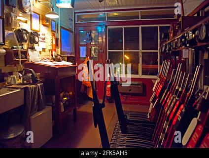 Night-time interior of  Wittersham Road signalbox on the Kent and East Sussex Railway, UK