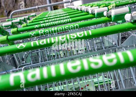 row of Raiffeisenmarkt shopping carts Stock Photo