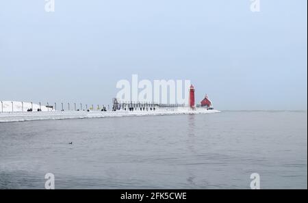 Grand Haven South Pier Lighthouse on Overcast Winter Day, Grand Haven, Michigan Stock Photo