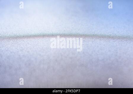 Abstract background with small dots focused in the center and blue tones out of focus at the edges Stock Photo