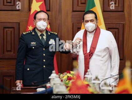 Colombo, Sri Lanka. 28th Apr, 2021. Sri Lankan Prime Minister Mahinda Rajapaksa (R) meets with visiting Chinese State Councilor and Minister of National Defense Wei Fenghe in Colombo, Sri Lanka, on April 28, 2021. Credit: Ajith Perera/Xinhua/Alamy Live News Stock Photo