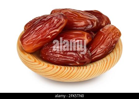 Dates in wooden bowl isolated on white background with clipping path and full depth of field. Stock Photo