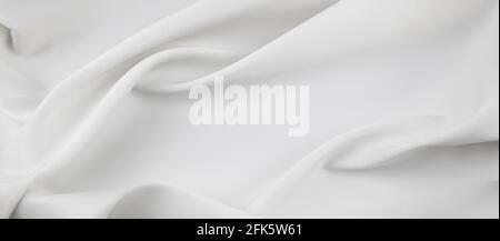 Closeup of rippled white silk fabric lines Stock Photo