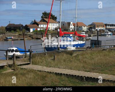 View of jetty and boats from the Walberswick side of the River Blyth looking across to Southwold Harbour. Stock Photo