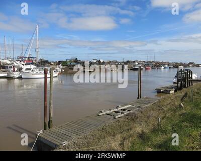 A Suffolk landscape on the River Blyth looking across from Walberswick to the fishing community at Southwold Harbour. Stock Photo