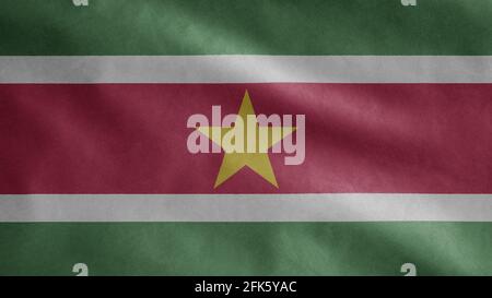 Surinamese flag waving in the wind. Close up of Suriname banner blowing, soft and smooth silk. Cloth fabric texture ensign background. Use it for nati Stock Photo