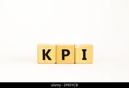KPI, key performance indicator symbol. Wooden cubes with word 'KPI, key performance indicator' on beautiful white background, copy space. Business, KP Stock Photo