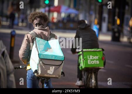 bike rider cycle courier Deliveroo online food delivery company Stock Photo
