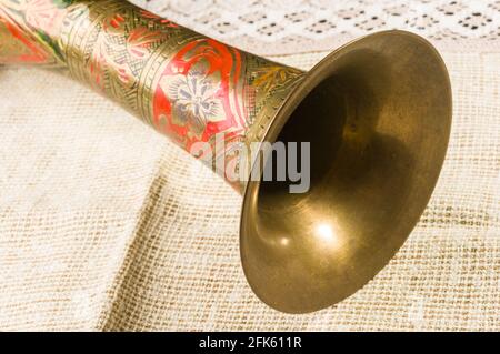 rustic coarse canvas fabric and a copper jug, close-up, background Stock Photo