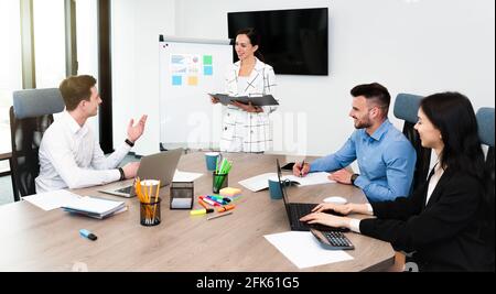Business people working together. Team listening the leader on business meeting Stock Photo