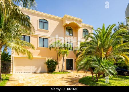 Photo series of single family homes in Golden Shores neighborhood in Sunny Isles Beach Florida USA Stock Photo