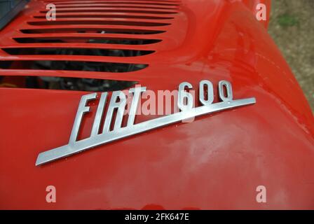The engine badge of a 1967 Fiat 600 parked up on display at the English Riviera classic car show, Paignton, Devon, England, UK. Stock Photo