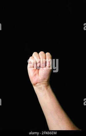 Letter M International sign language dark background Stock Photo