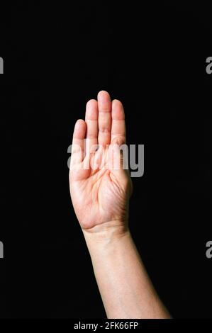 Letter B International sign language dark background Stock Photo