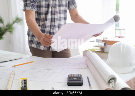 Architect or engineer working in office Stock Photo