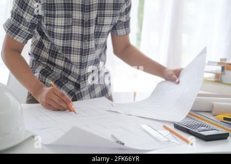 Architect or engineer working in office Stock Photo