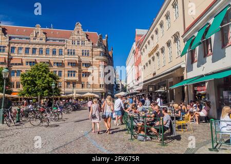 MALMO, SWEDEN - AUGUST 27, 2016: People enjoy a sunny day at Stortorget square in Malmo, Sweden. Stock Photo