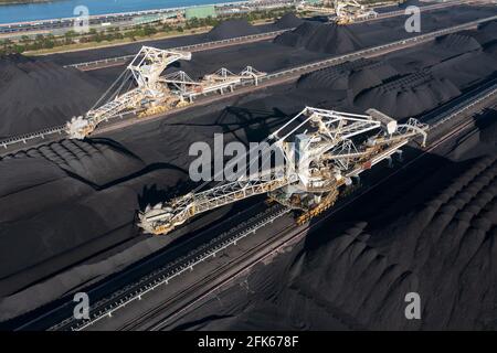 Aerial view of coal scoop conveyors and coal stockpiles, Port of Newcastle, Australia. Stock Photo