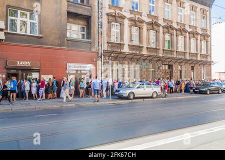 KRAKOW, POLAND - SEPTEMBER 4, 2016: People wait in a queue for an ice cream at Lody na Starowislnej, famous ice cream place in Krakow, Poland. Stock Photo