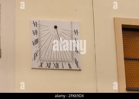 Street Square Clock. Interesting clock on the facade of a house in Poland. Stock Photo