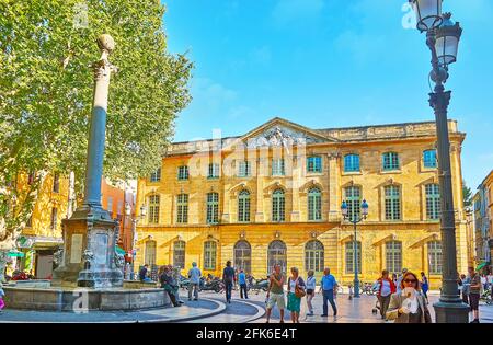 AIX-EN-PROVENCE, FRANCE- MAY 6, 2013: Fountain of Hotel de Ville in front of the Library Halle aux Grains building, located in Hotel de Ville square Stock Photo