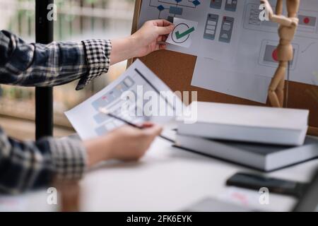 Designer woman drawing website ux app development at home office. User experience concept Stock Photo