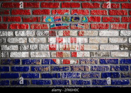 National flag of Croatia  depicting in paint colors on an old brick wall. Flag  banner on brick wall background. Stock Photo