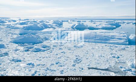 Climate Change. Iceberg afrom glacier in arctic nature landscape on Greenland. Icebergs in Ilulissat icefjord. Melting of glaciers and the Greenland Stock Photo