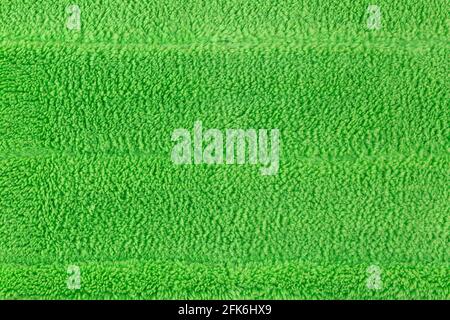 Background texture of new clean green microfiber mop floor wiper cleaning sweeping tool Stock Photo