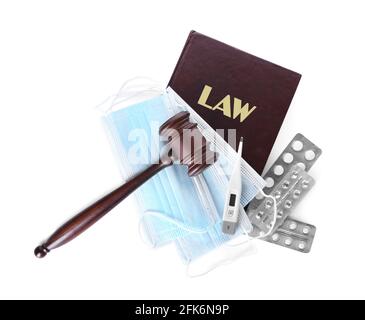 Judge gavel, masks, book and pills on white background. Concept of health care reform Stock Photo