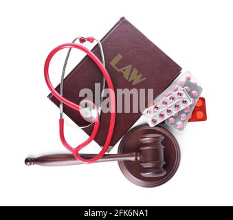 Judge gavel, book, stethoscope and pills on white background. Concept of health care reform Stock Photo