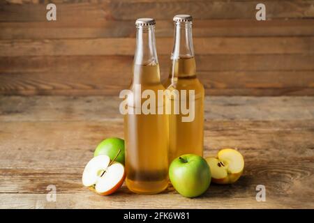 Bottles of apple cider on wooden background Stock Photo