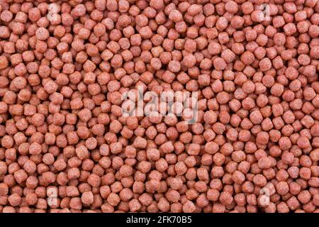 Closeup texture of ready made food mix for bird to enhance immunity and shiny feather for Mynah, Starling Stock Photo