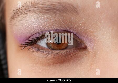 Close up of eye of young woman with makeup Stock Photo