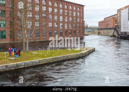 Old Tampella and Finlayson industrial buildings by the water in Tampere Finland Stock Photo