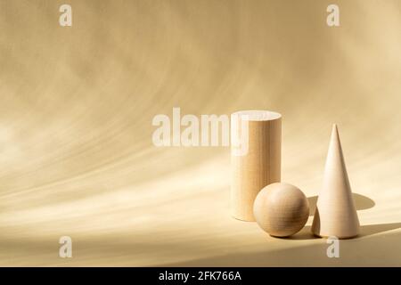 wooden greometric shapes on beige background. Can be used for podiums or display of your products. Copy space for text. Stock Photo