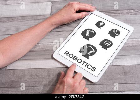 Robotics concept shown on a tablet used by a woman Stock Photo