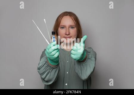 Coronavirus test kit in female hand. Covid-19 rapid self-test Stock Photo