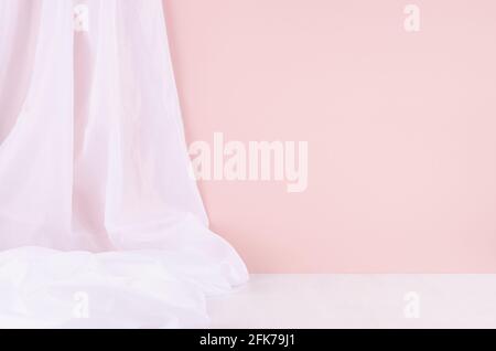 Abstract modern minimal scene or interior with soft light pastel pink wall, white silk curtain and white wood table of floor. Background for display, Stock Photo