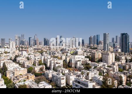 Tel Aviv skyline over Kikar Hamedina square with business district skyscrapers in the horizon, Aerial view. Stock Photo